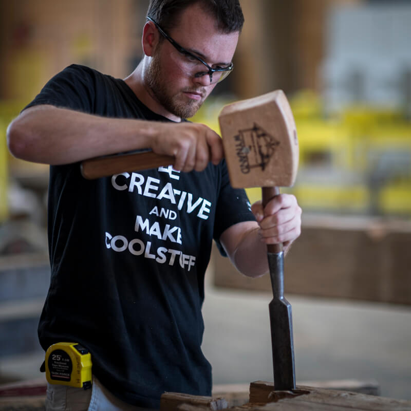 entry level timber framer using a mallet